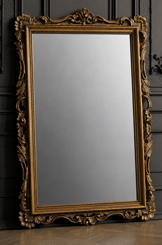 Grand miroir de style baroque doré en bois sculpté